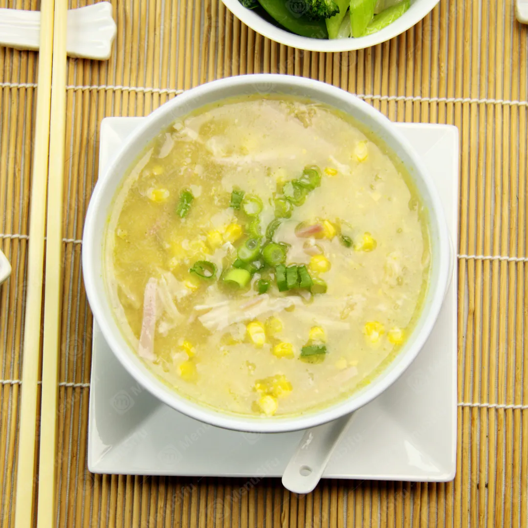 Chicken Rcie Soup is a warm and savory soup made with chicken, corn kernels, and garnished with chopped scallions at Queen Bakery II, a Chinese restaurant in NY